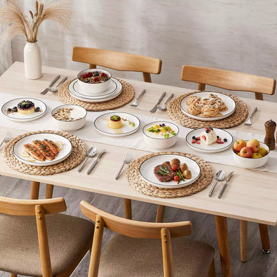 MINA porcelain dinnerware set featuring curved-edge plates and bowls with lifted rims#color_black-trim