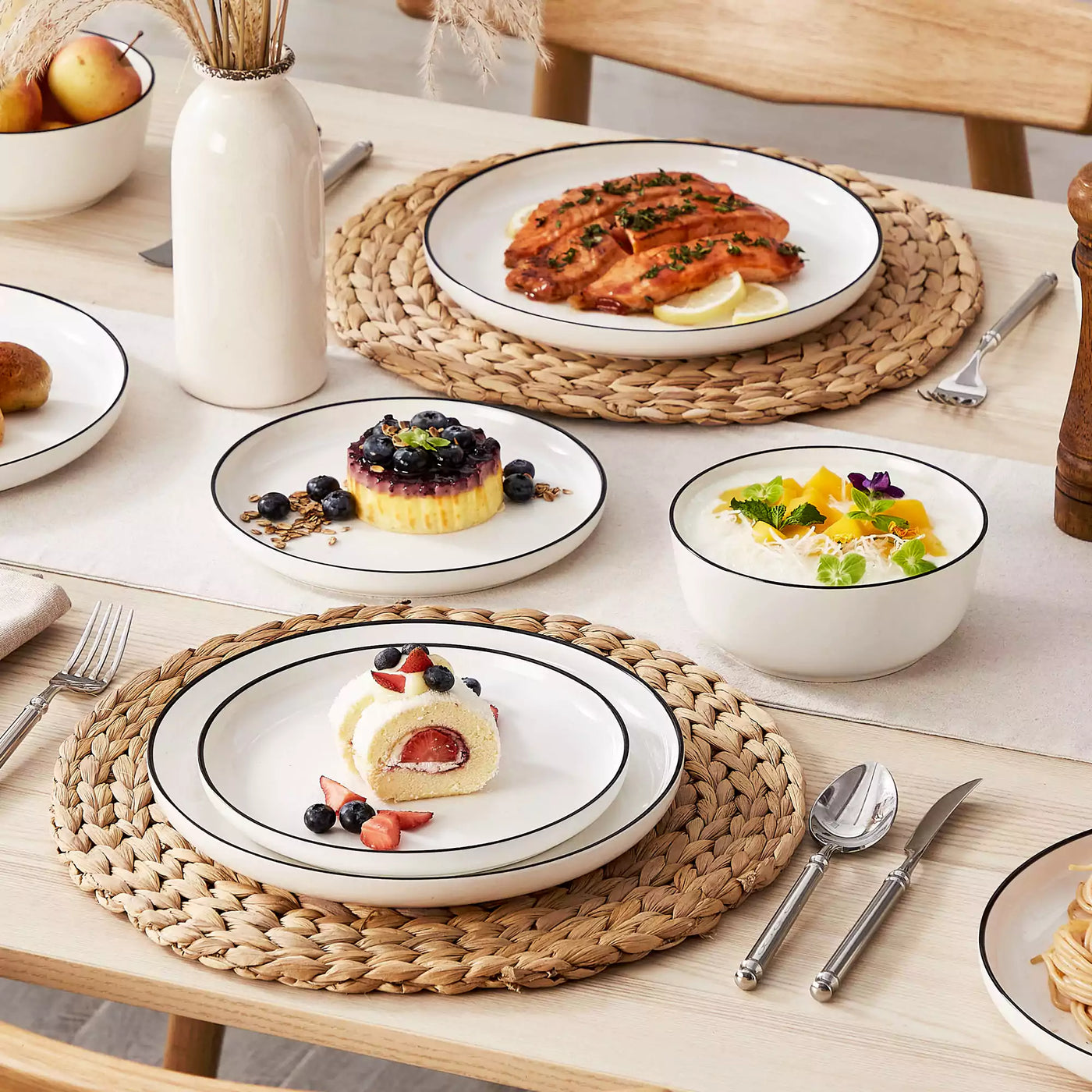 MINA porcelain dinnerware set featuring curved-edge plates and bowls with lifted rims#color_black-trim