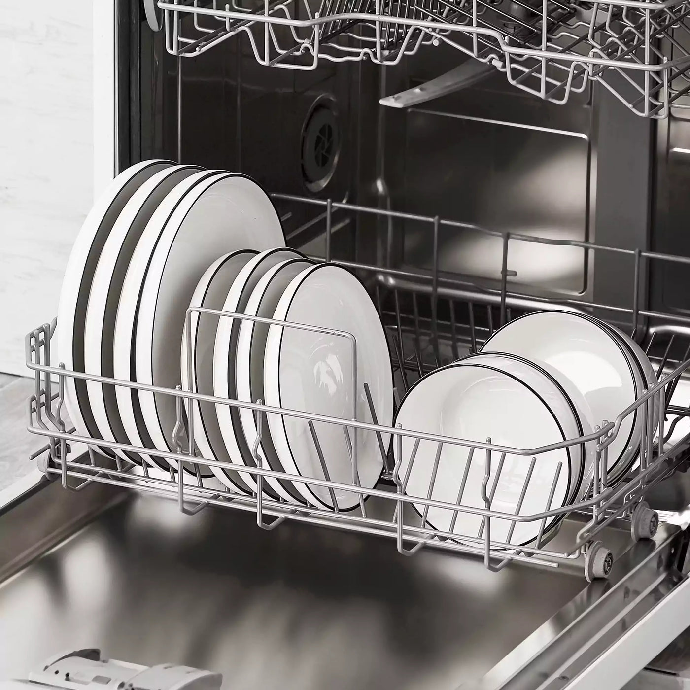 MINA porcelain dinnerware set featuring curved-edge plates and bowls with lifted rims#color_black-trim