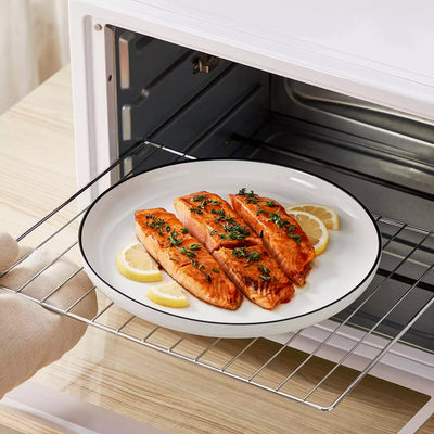 MINA porcelain dinnerware set featuring curved-edge plates and bowls with lifted rims#color_black-trim