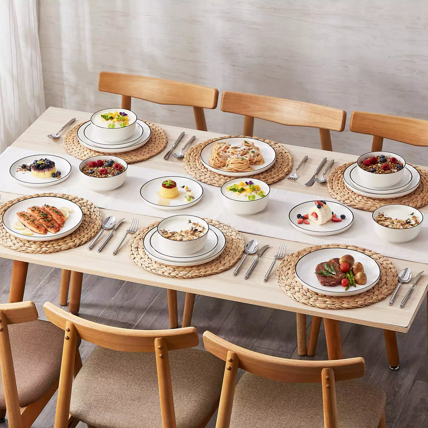 MINA porcelain dinnerware set featuring curved-edge plates and bowls with lifted rims#color_black-trim