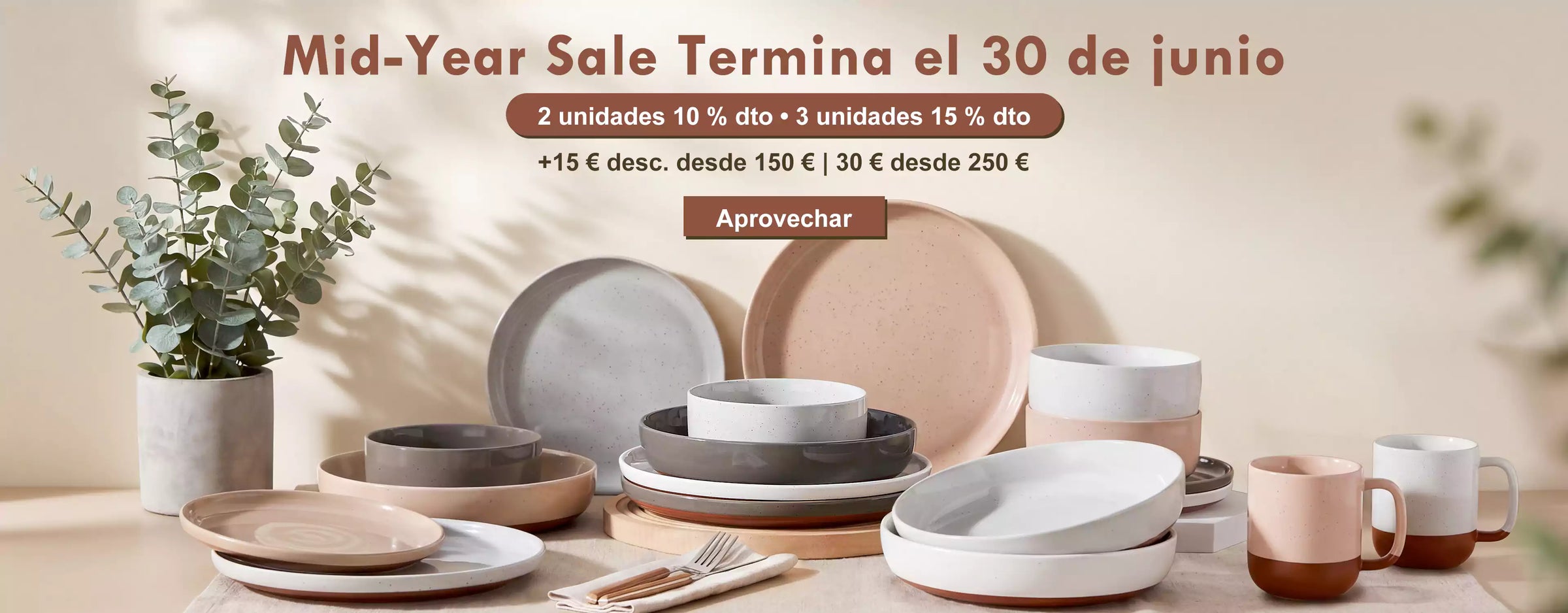 Dining set with plates, cups, and bowls on a table with promotional text for a mid-year sale.